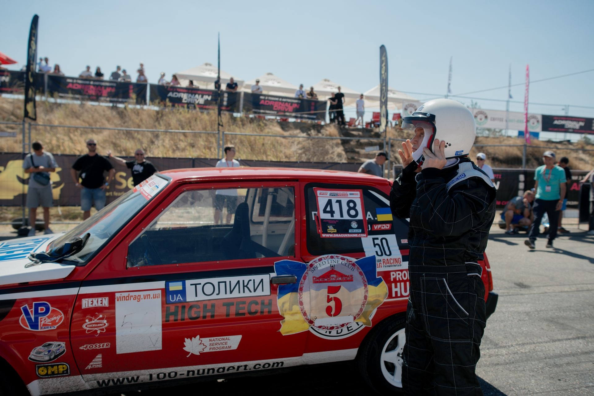 A driver next to his car before a drag race in Odesa, Ukraine, on Aug. 10, 2025.